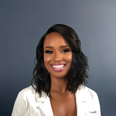 Contessa Metcalfe Smiling In Lab Coat